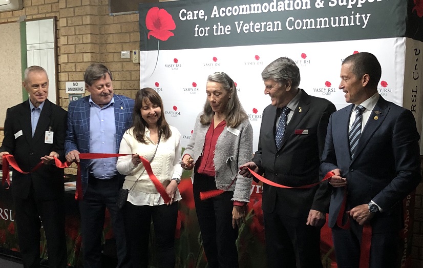 Liz Vasey Kosckhitzke cuts the ribbon, with (from left) General Manager Property Services Steve Best, Board Vice Chair Barry Lee, CEO Janna Voloshin, Board Chair Mike O’Meara OAM, and General Manager Veteran Services Chris Gray.