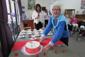 Vasey RSL Care celebrates twenty years at our Brighton Aged Care Home with resident Judy cutting the cake